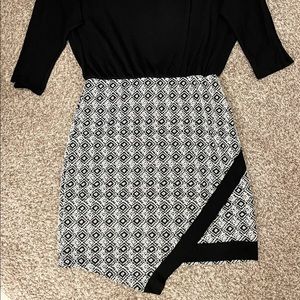 Asymmetrical dress with houndstooth patterned skirt